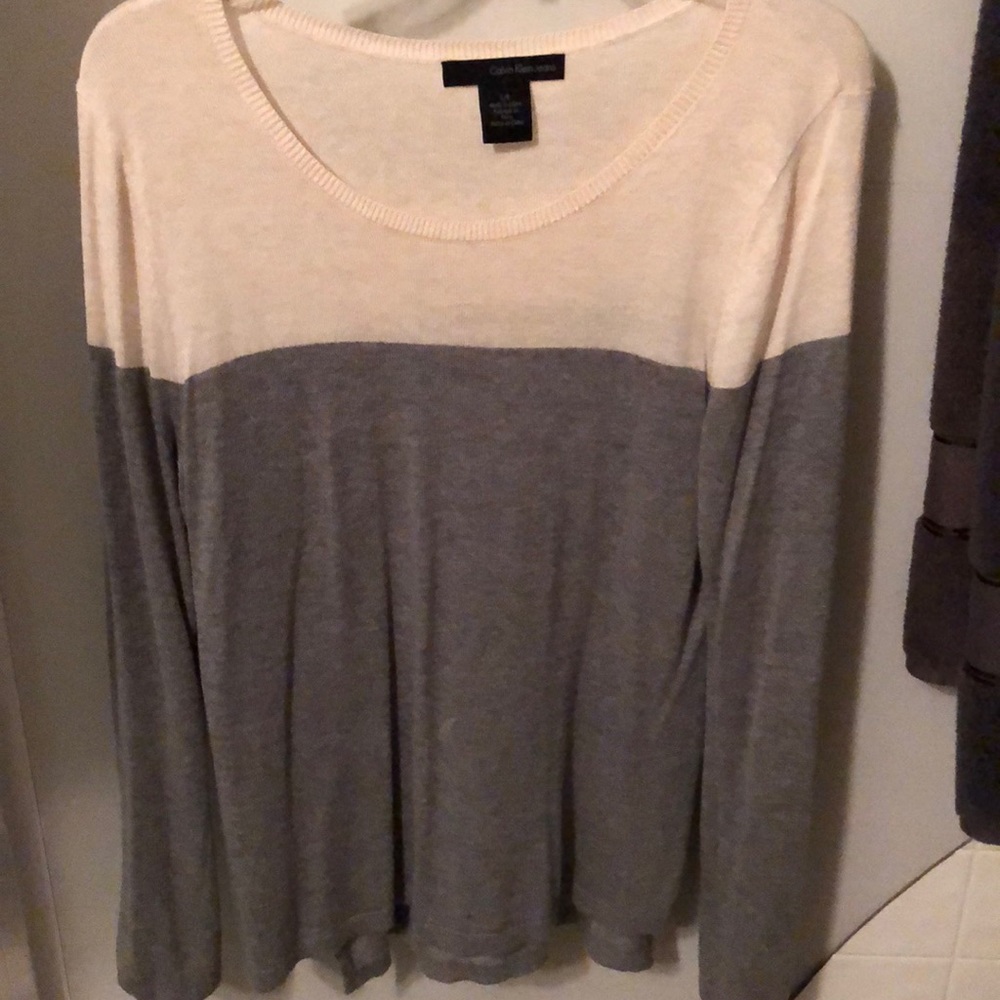 Calvin Klein jean gray and white sweater.
